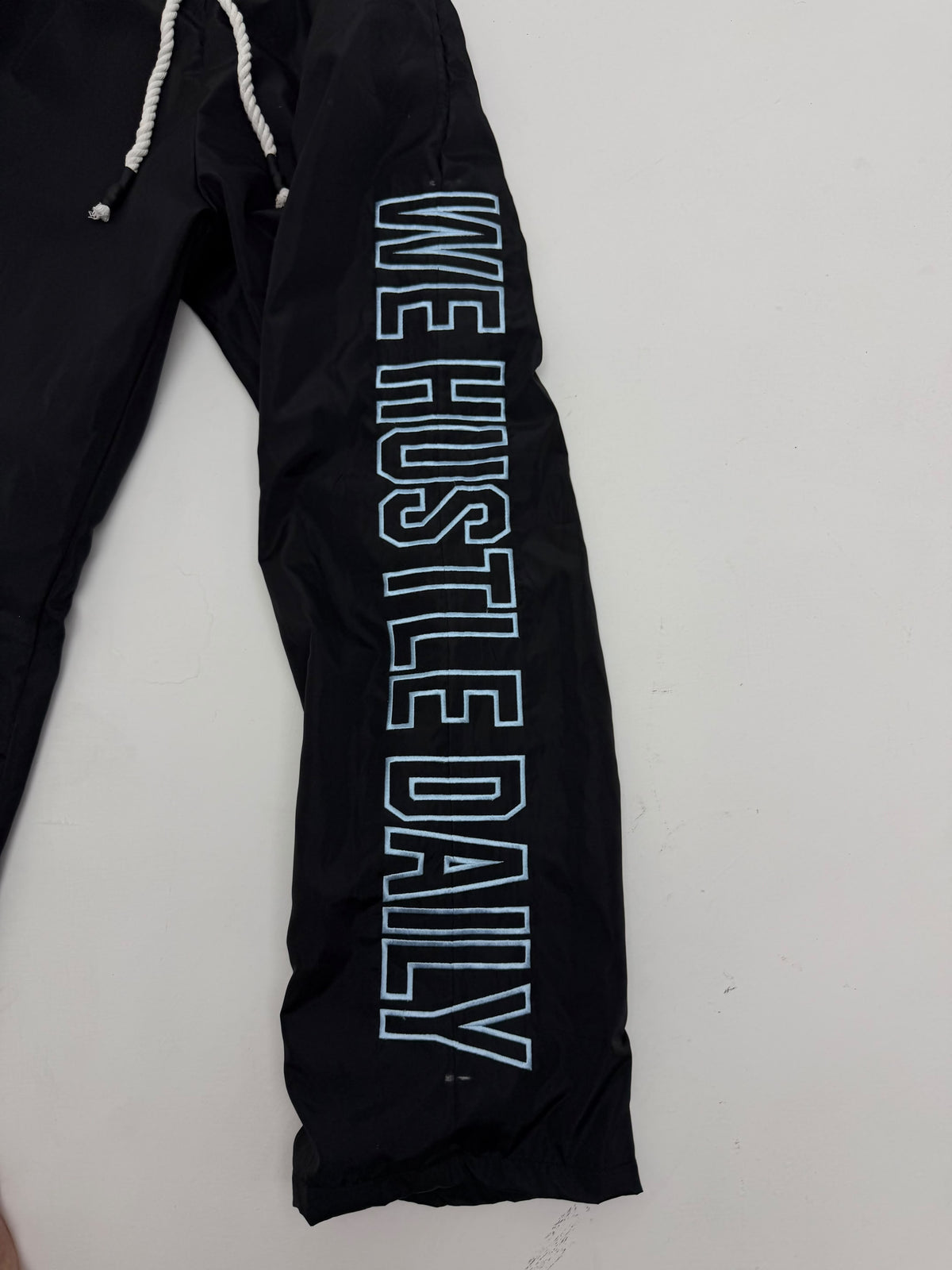 WE HUSTLE DAILY TRACK PANTS